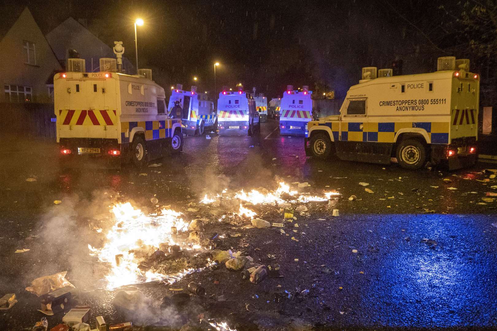 PSNI Tactical Support Group (TSG) officers in attendance during disorder in Londonderry (Liam McBurney/PA)