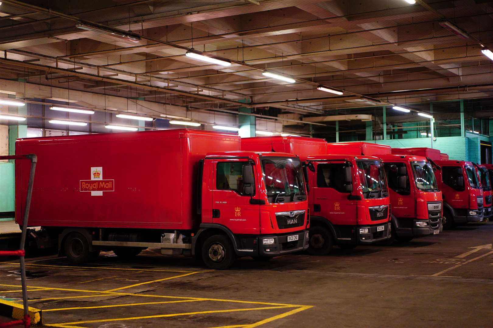 Royal Mail delivery vans parked up inside the Whitechapel delivery office (Victoria Jones/PA)