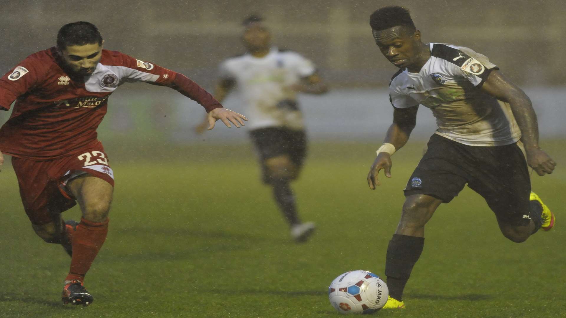 Dover's Toby Ajala takes on Barney Williams. Picture: Tony Flashman