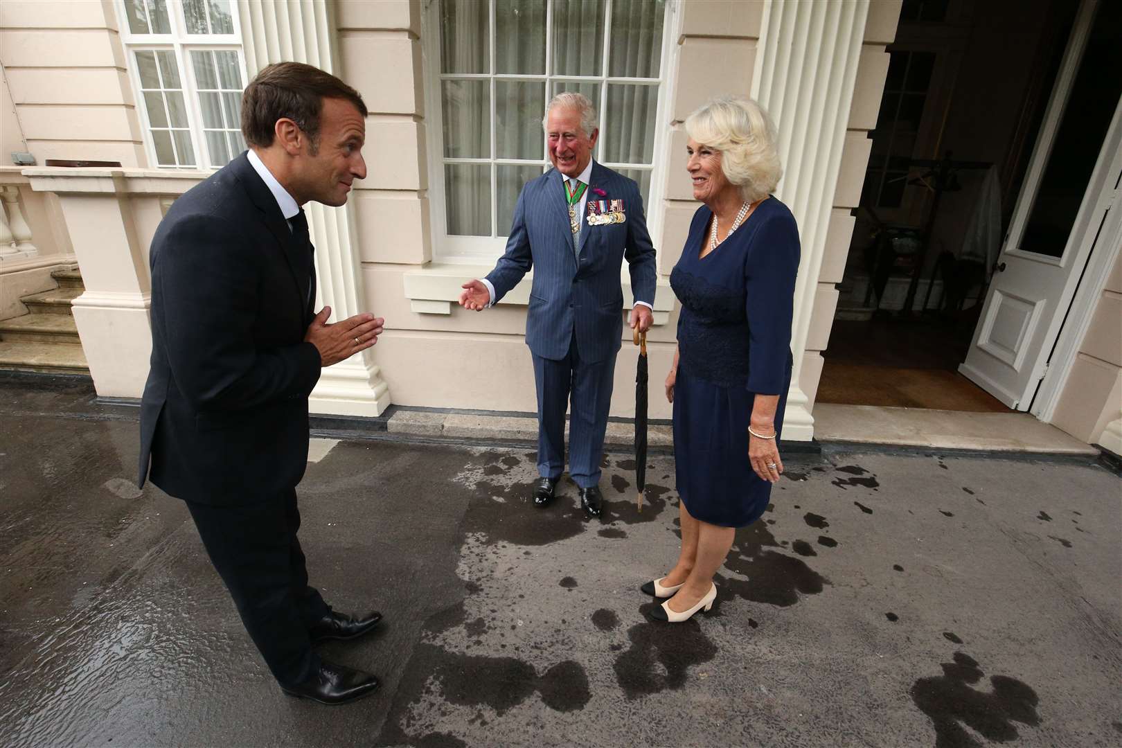 The Prince of Wales and the Duchess of Cornwall greet Emmanuel Macron (Jonathan Brady/PA)