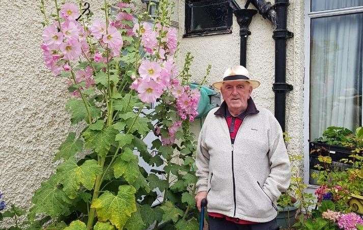 Patrick O'Brien with his prized hollyhocks