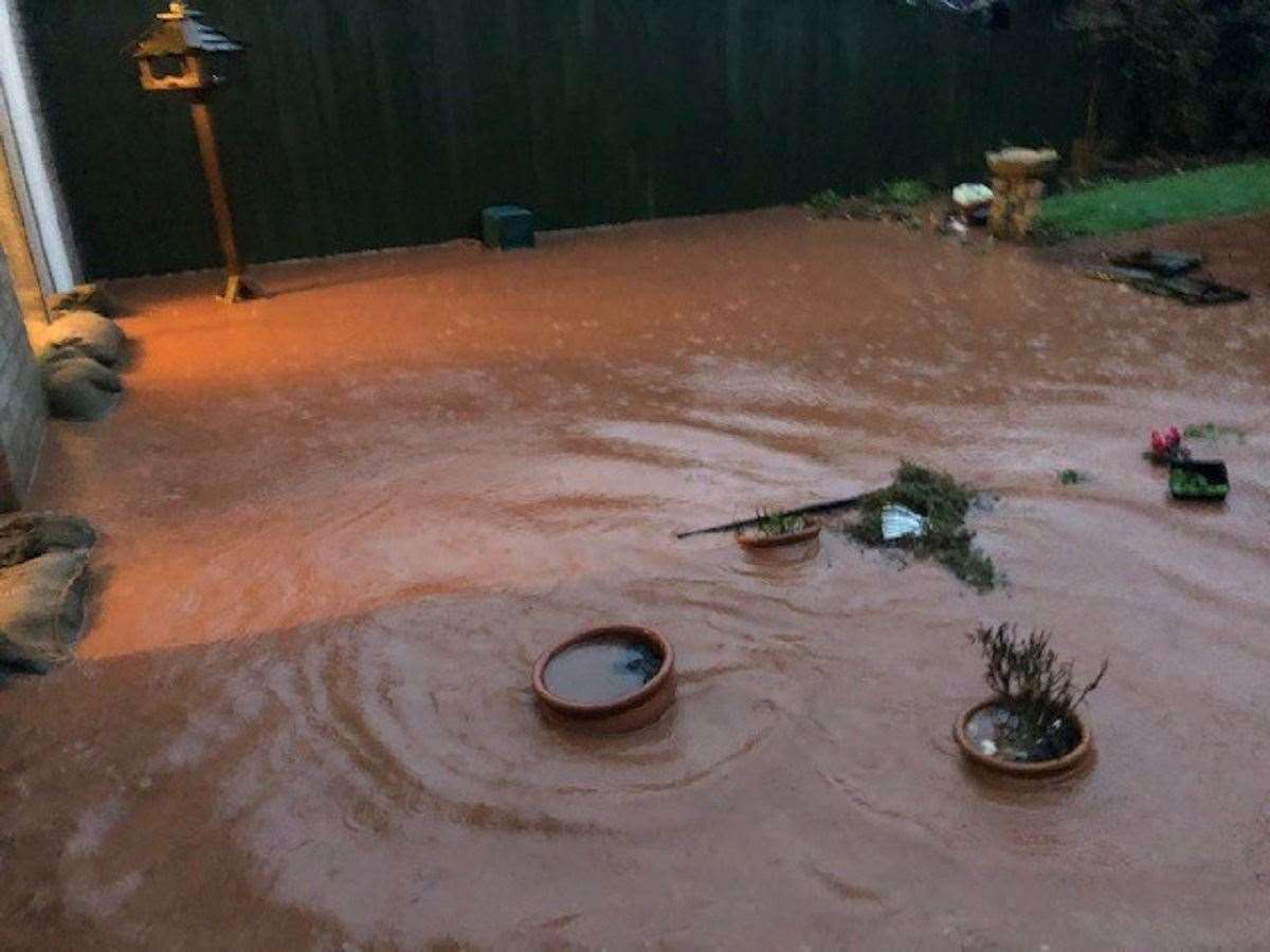 Flooding in Mrs James’s garden (Craig James/PA)