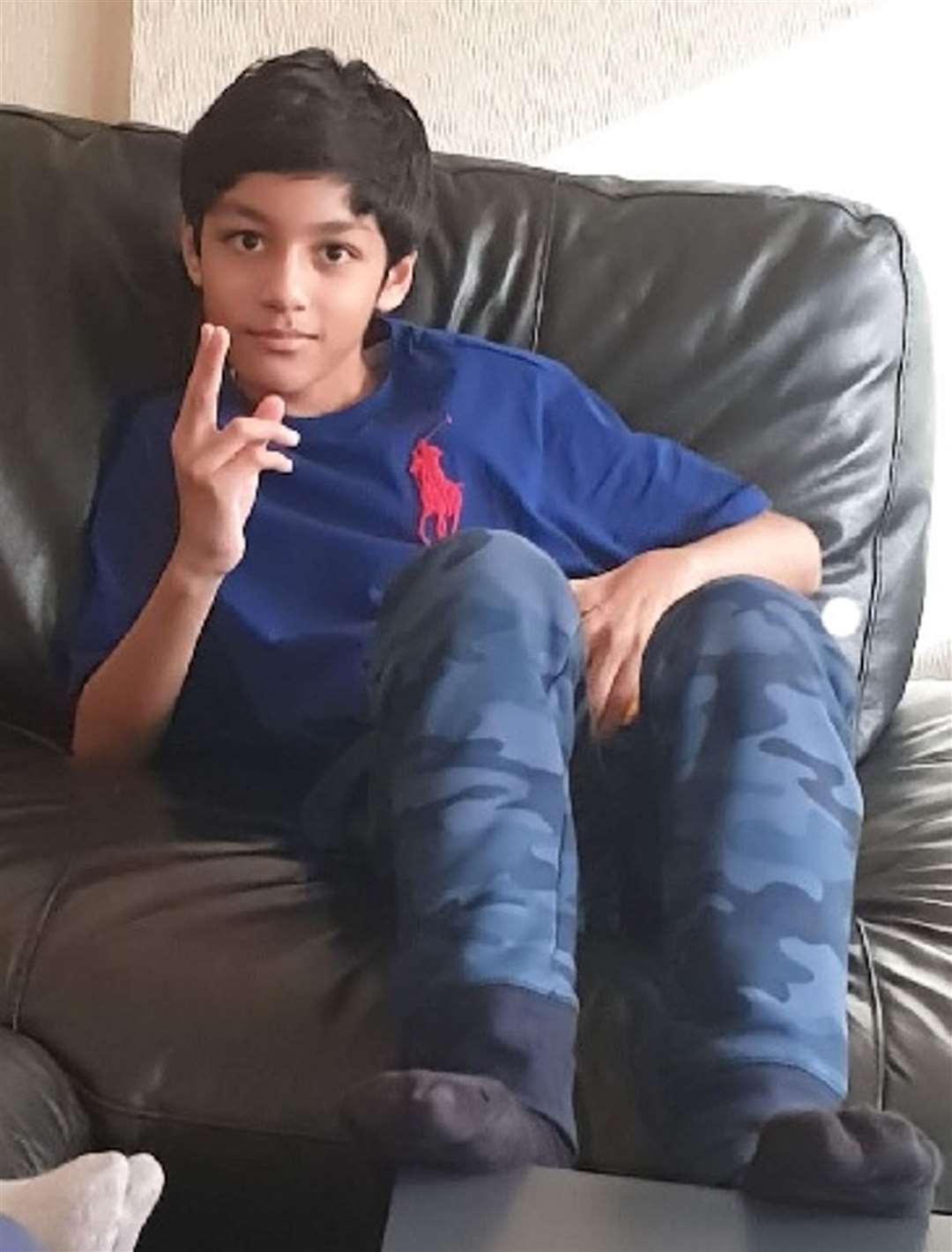 Zaheid Ali relaxing on a sofa (City of London Police/PA)