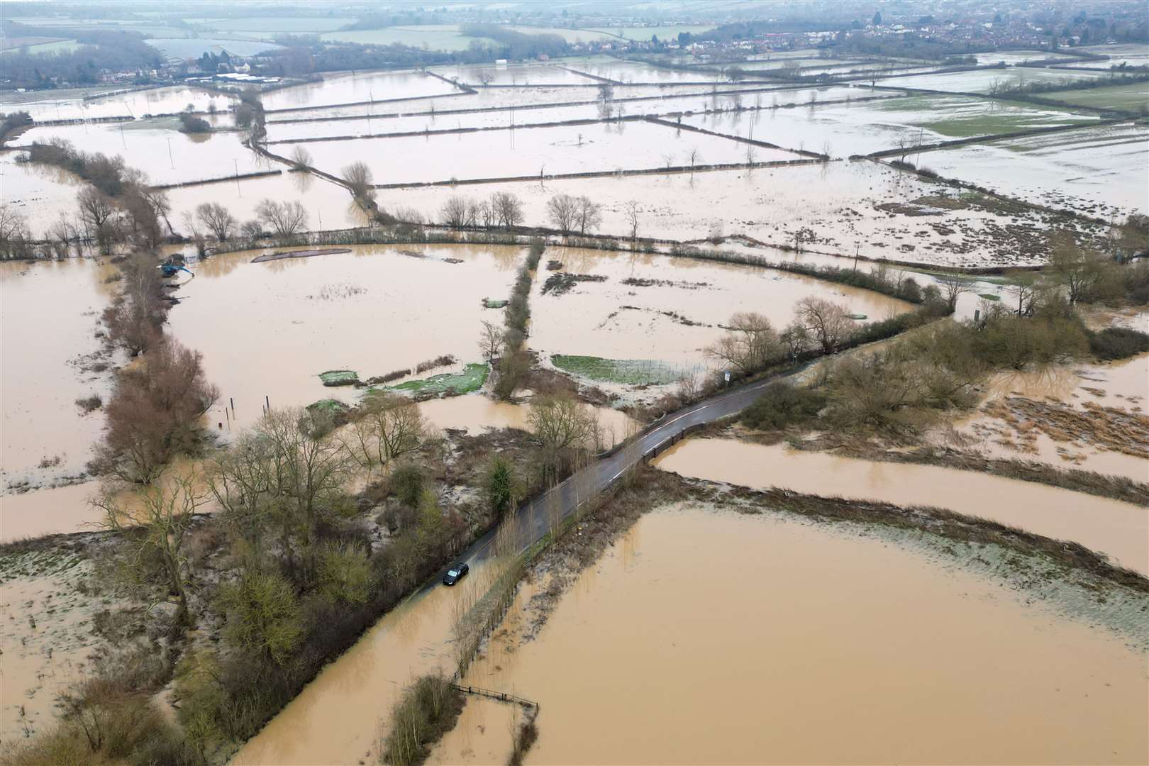 An abandoned car on a flooded road in Mountsorrel in Leicestershire (Joe Giddens/PA)