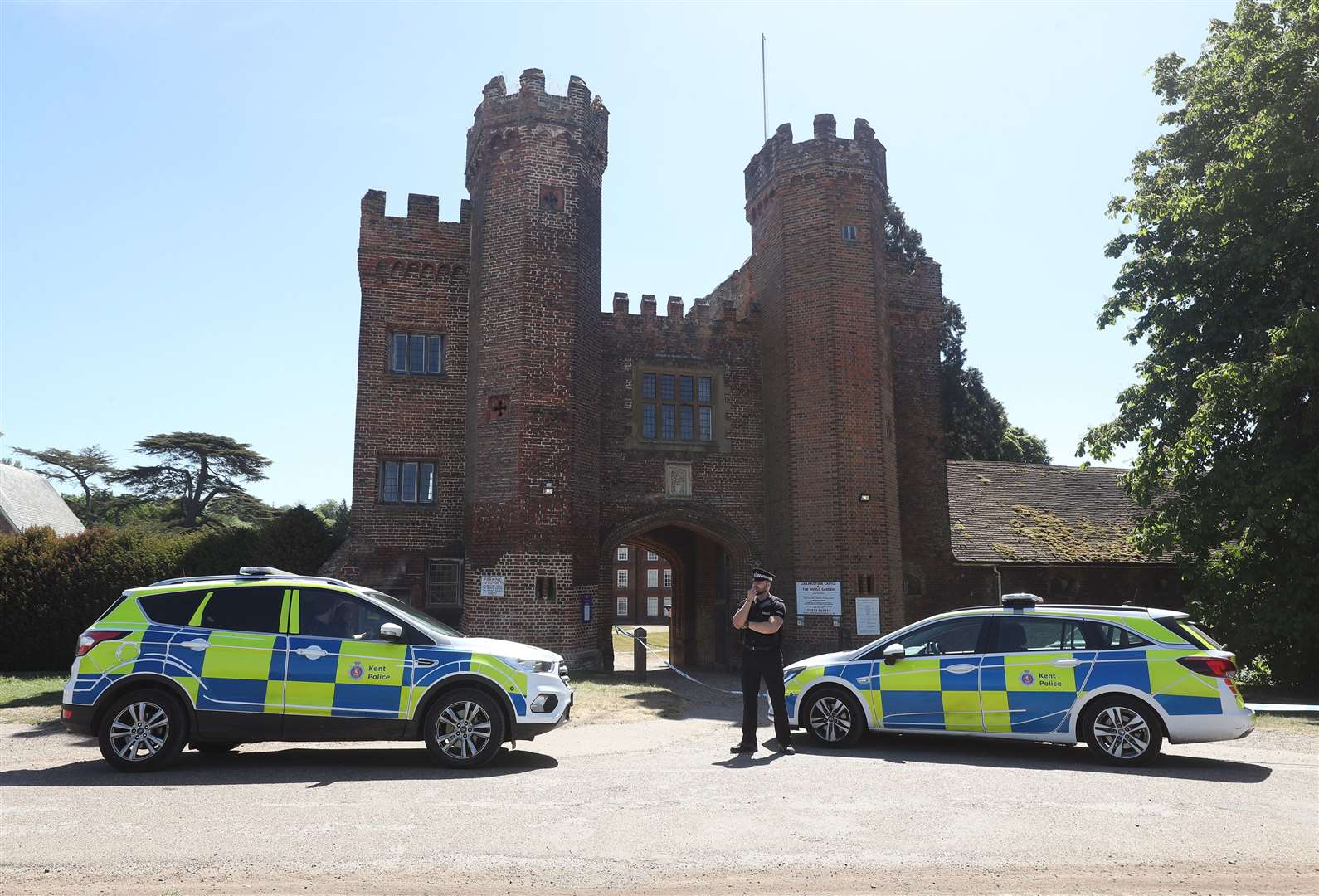 Police at the entrance to Lullingstone Castle in Eynsford, Kent, where a man died after reports of a disturbance in the grounds (Yui Mok/PA)