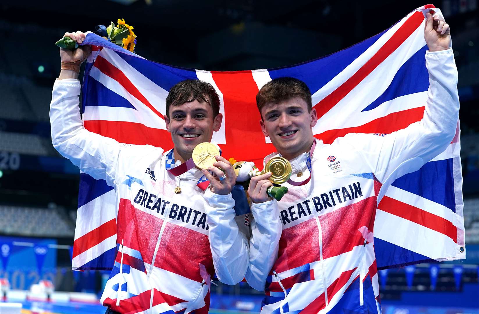 Tom Daley and Matty Lee celebrate winning gold (PA)