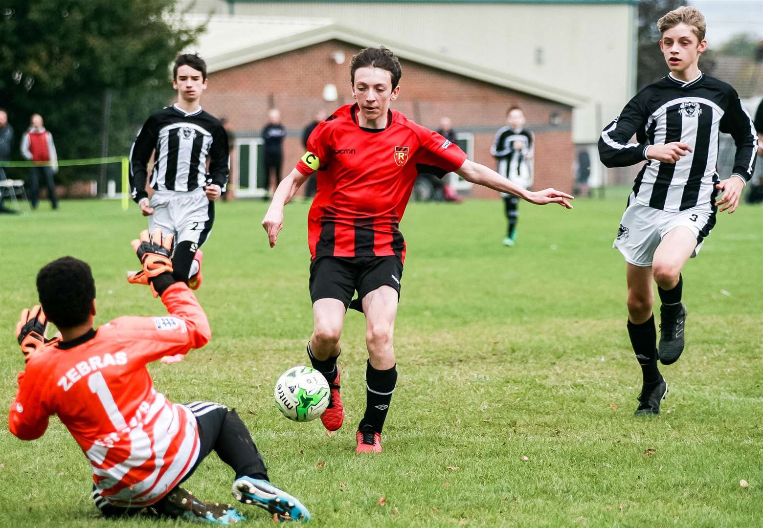 Rainham 84 Warriors under-14s (red) burst through against Milton & Fulston United under-14s on Sunday Picture: Phil Lee FM19227340