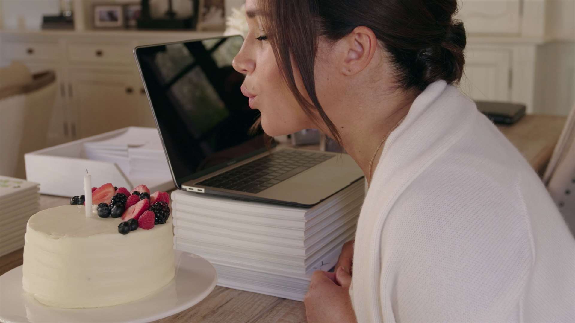 Meghan blows out a candle on her birthday cake (Archewell)