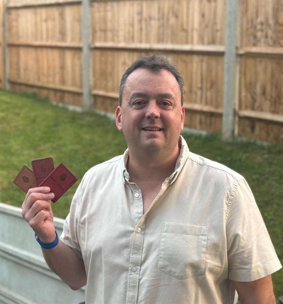 Jonny Siberry with the old driving licences dating back to 1935 and found in a Chatham car park