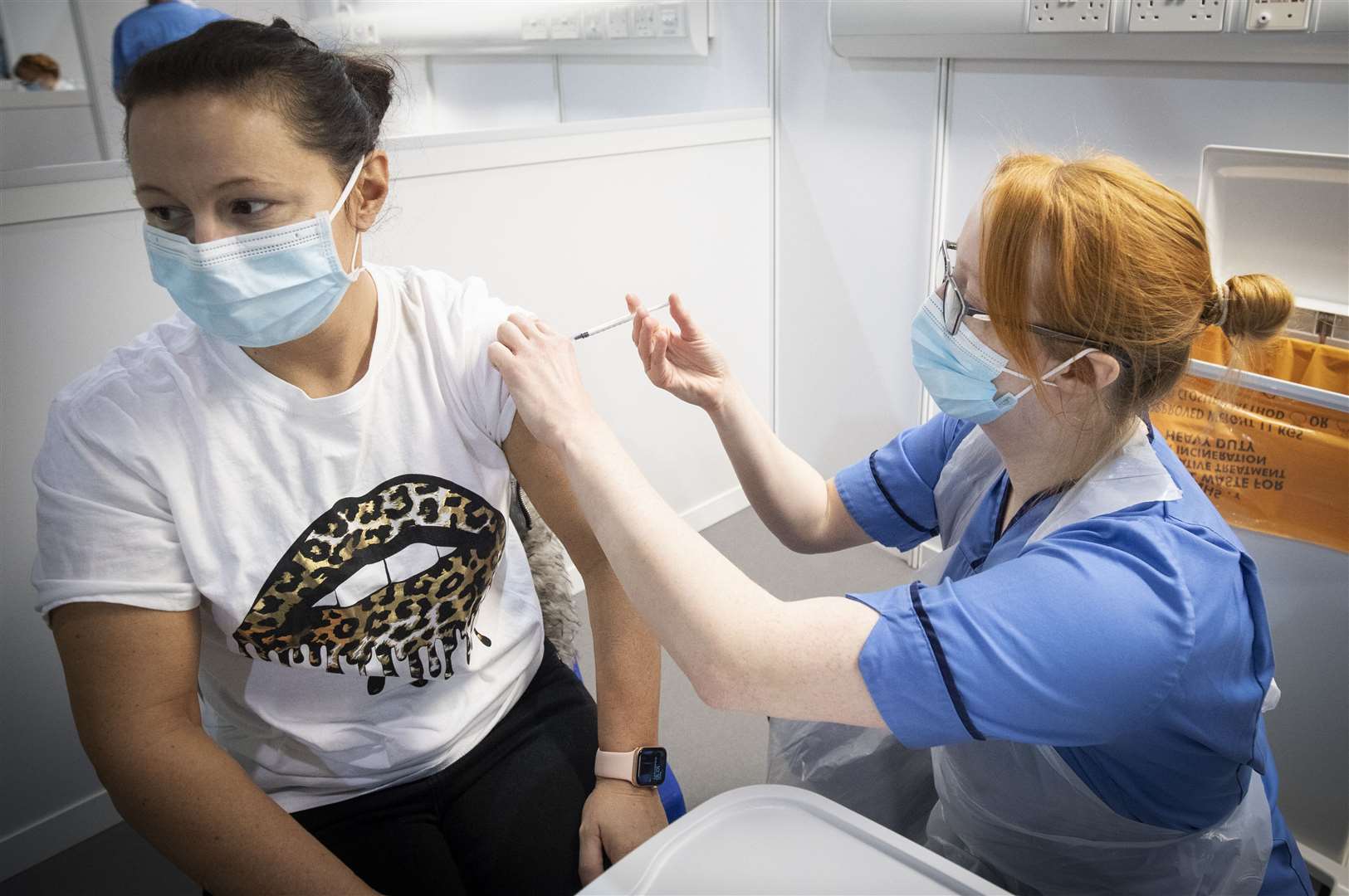 A nurse administers a coronavirus vaccine (Jane Barlow/PA)