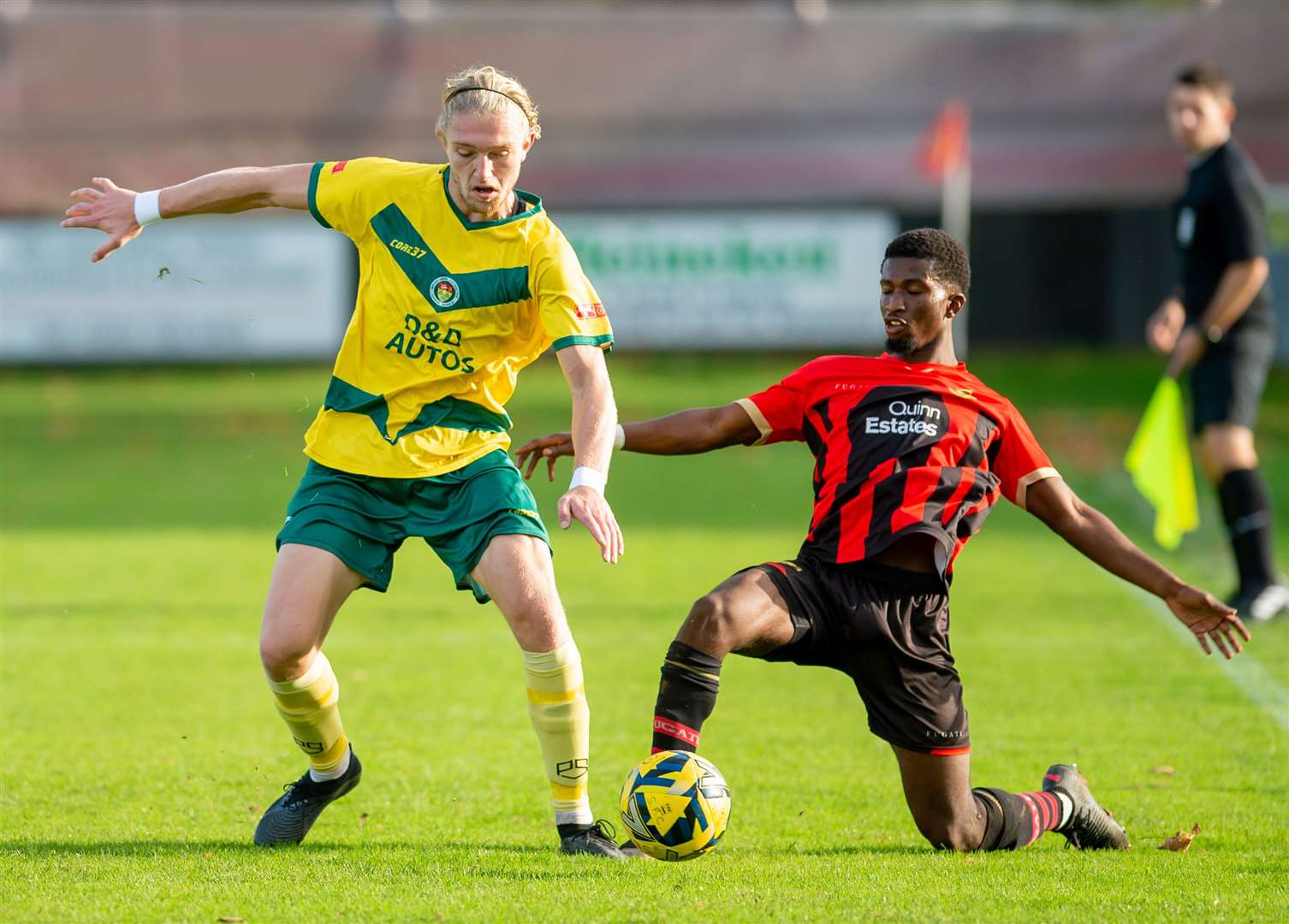 Sittingbourne goalscorer Donvieve Jones challenges Ashford man Charlie Dickens. Picture: Ian Scammell