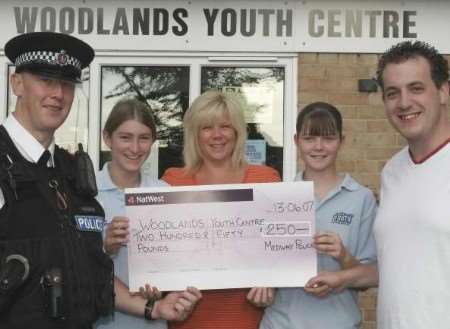 PC Alex Bain, left, handed over the cheque to Sharon McCauley, youth development officer, Richrd aHillier, youth worker, and club members Tammy Utteridge and Leanna Zahra. Picture: PETER STILL