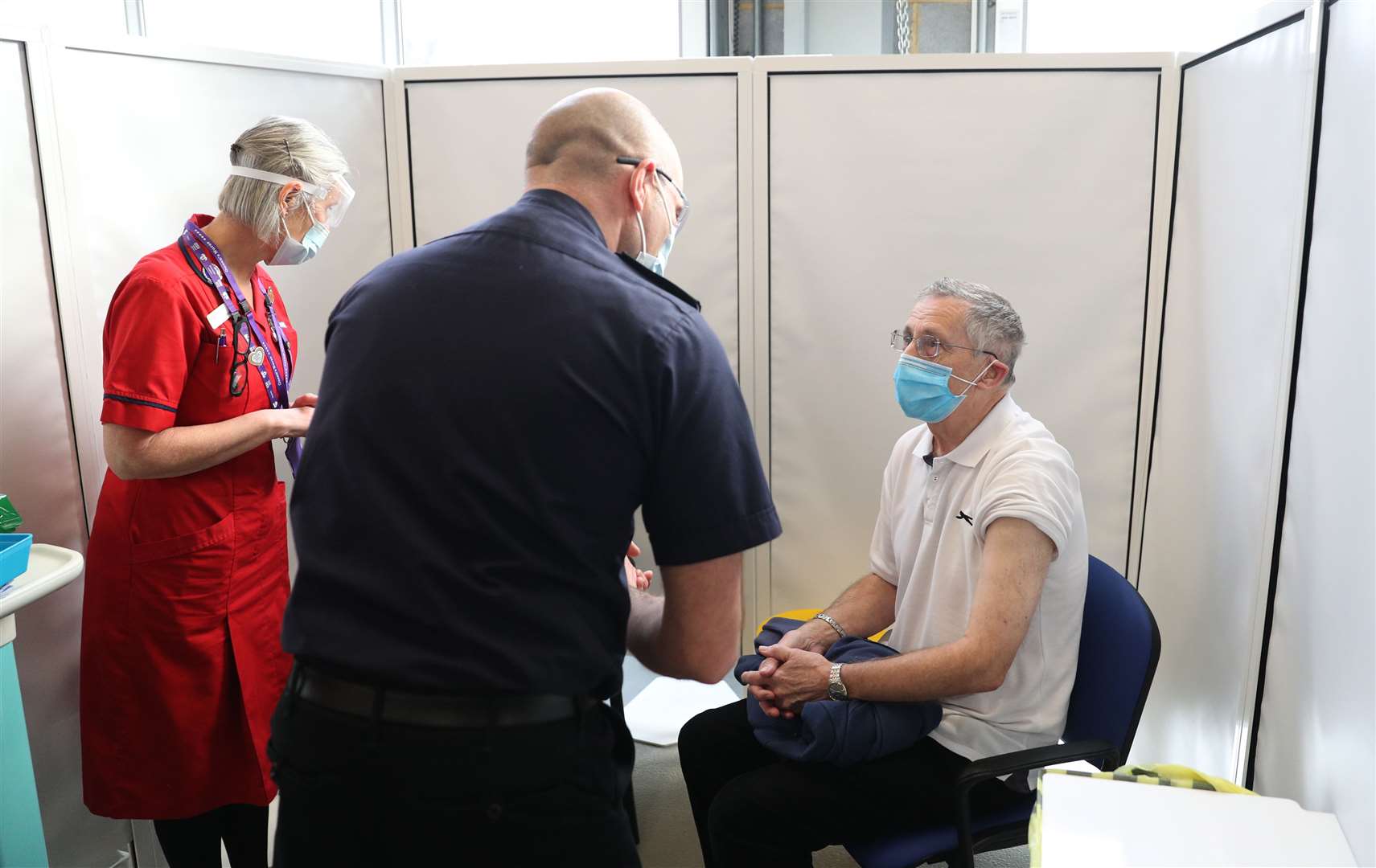 Peter Brownsea, from Southampton, prepares to receive the Oxford/AstraZeneca vaccine (Andrew Matthews/PA)