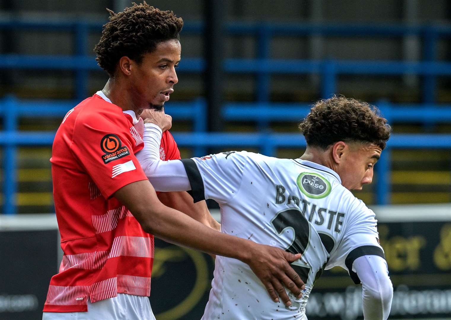 Dover's Luke Baptiste is closely marked by Fleet defender Sido Jombati. Picture: Stuart Brock