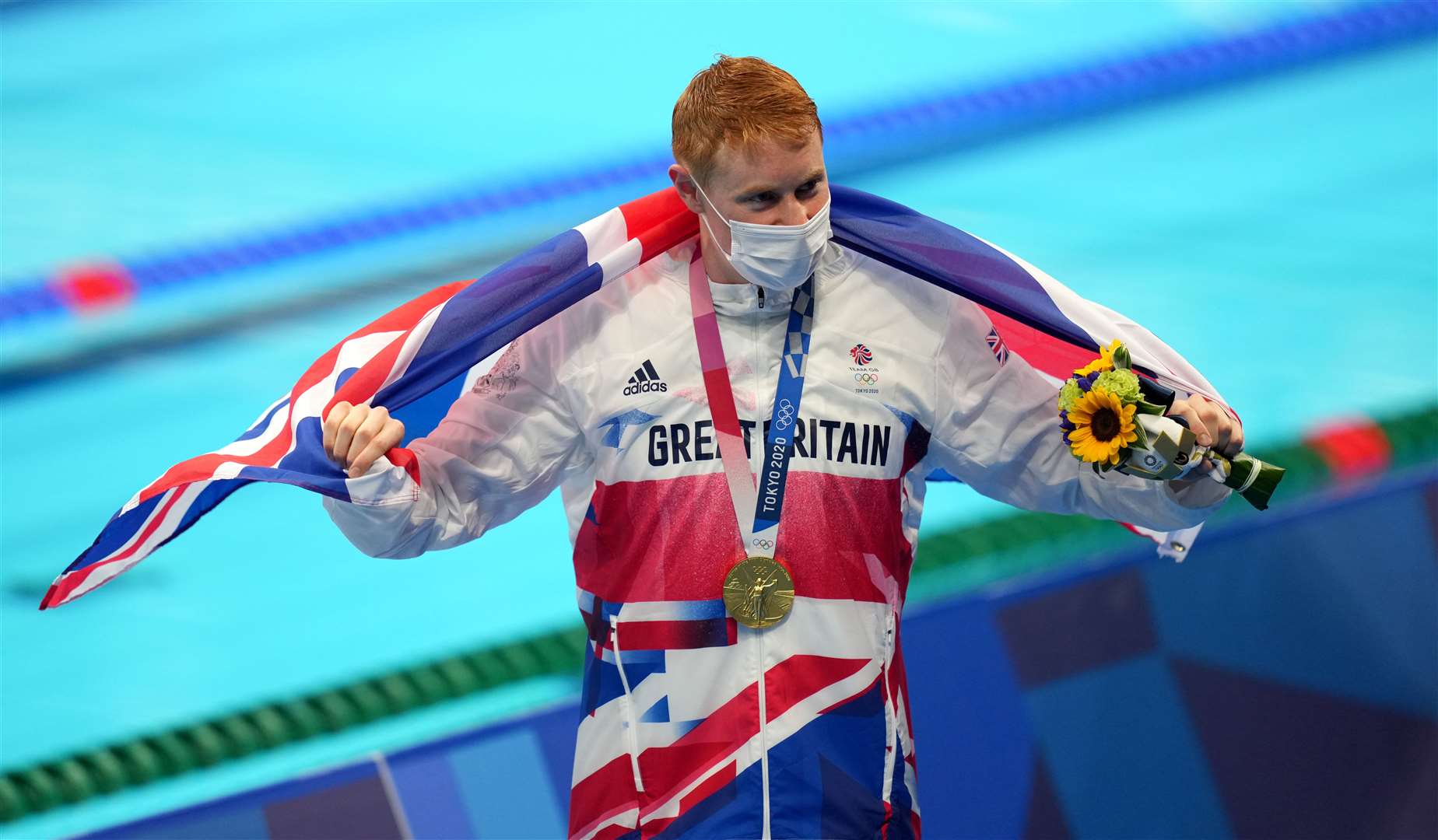 Dean with his gold medal celebrates after winning the Men’s 200m Freestyle (Joe Giddens/PA)