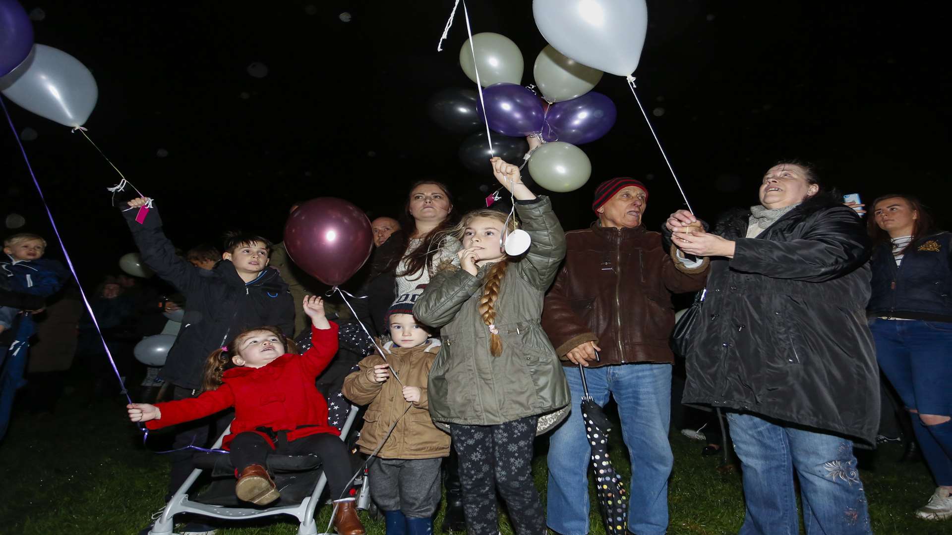 Joe Bisgin's partner Natalie Watson, centre, with their children Joe and Macie, his son Riley, left, her daughter Grace, and Mr Bisgin's mum Debbie Bisgin, right