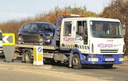 One of the vehicles involved in the crash is towed away