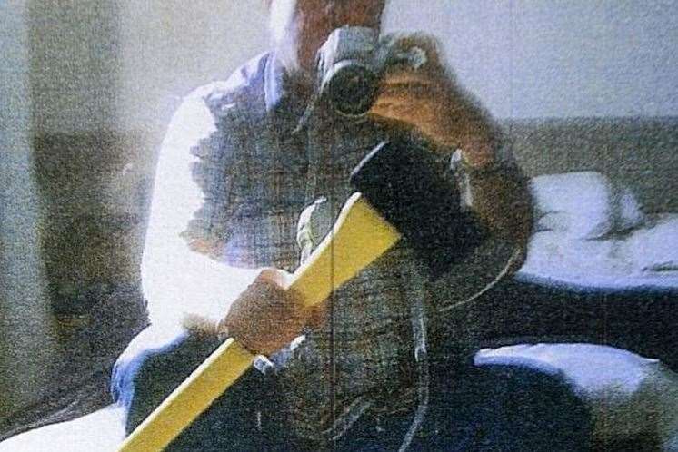 Dale Bolinger photographed himself with the axe he bought