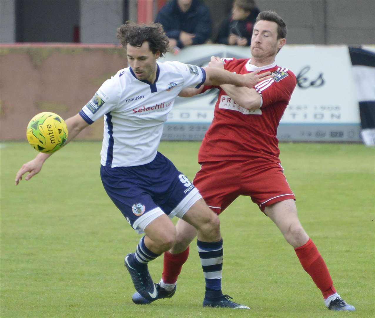 Hythe's Chris KInnear tussles with Corinthian Casuals' Harry Ottaway. Picture: Paul Amos