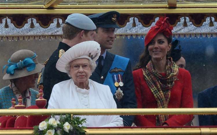 The Queen with the Duke of Sussex and the Duke and Duchess of Cambridge on the royal barge Spirit of Chartwell during the Diamond Jubilee River Pageant. Photo: Adrian Dennis/PA