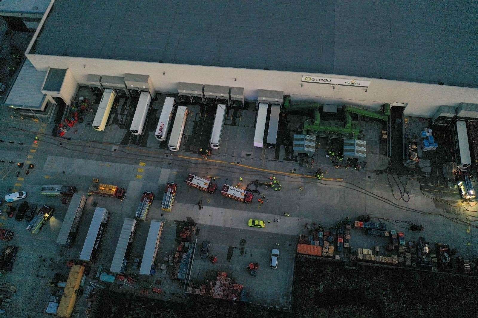 The scene at the warehouse on Friday as firefighters dampen down Picture: UKNIP