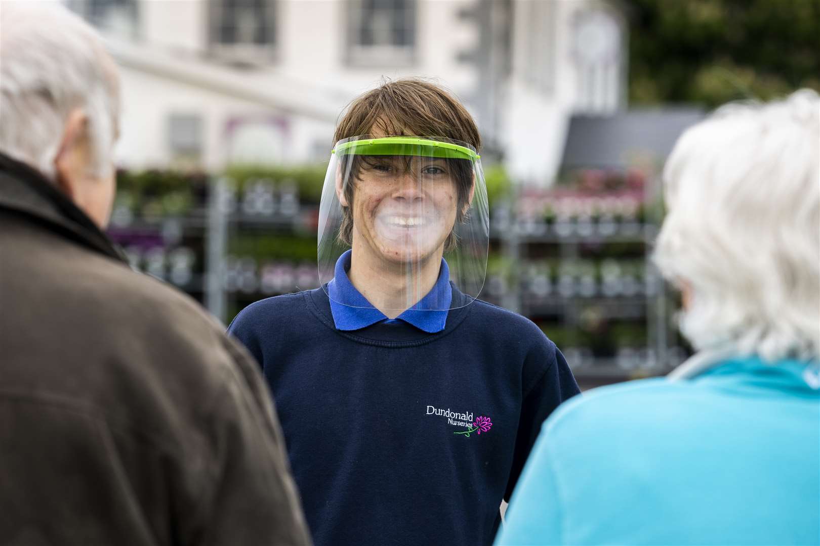 Josh Trimble greets people to Dundonald Nurseries in Belfast as garden centres in Northern Ireland reopen after the lockdown. (Liam McBurney/PA)