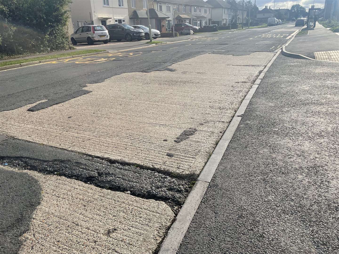 Bare concrete can be seen in patches on Jemmett Road