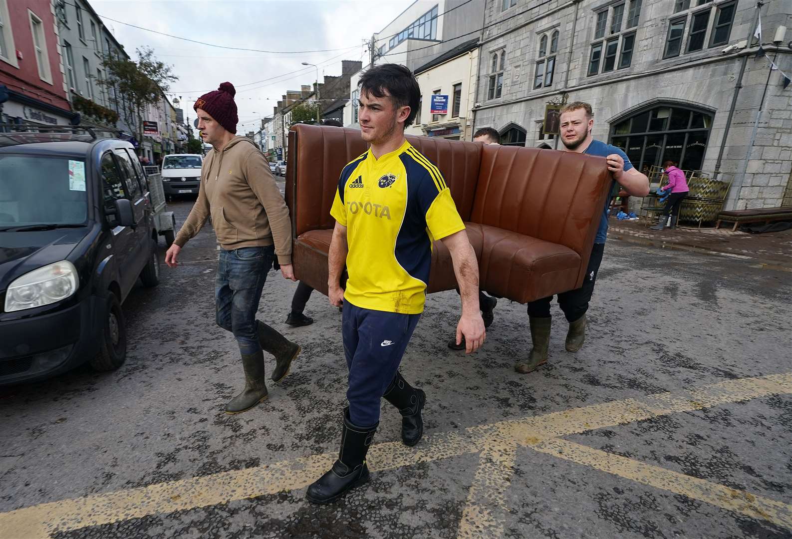 The clean-up gets under way on Main street in Midleton (Brian Lawless/PA)