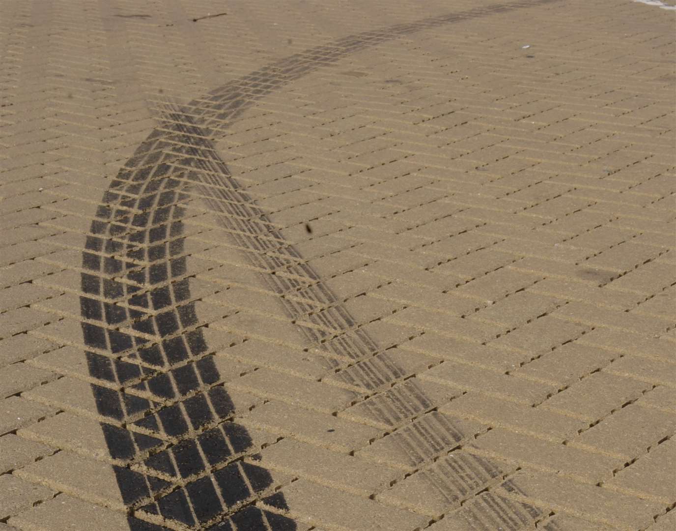 Tracks left by boy racers doing doughnut spins. Picture: Gary Browne