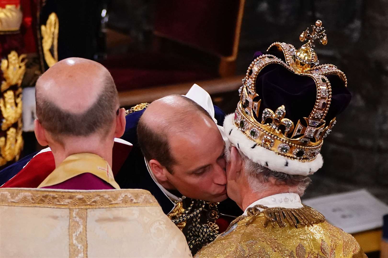 The Prince of Wales kisses his father during Charles’s coronation ceremony (Yui Mok/PA)