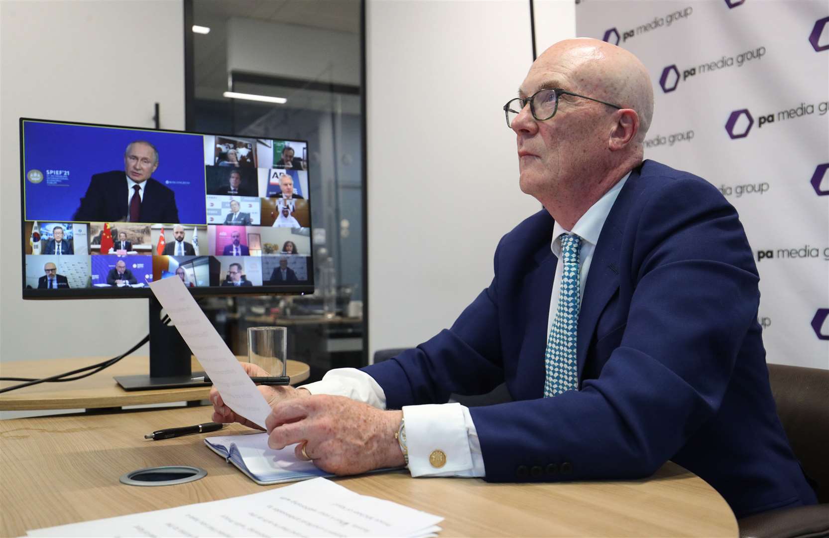 PA Media Group CEO Clive Marshall listens to Russian President Vladimir Putin answer questions (Jonathan Brady/PA)