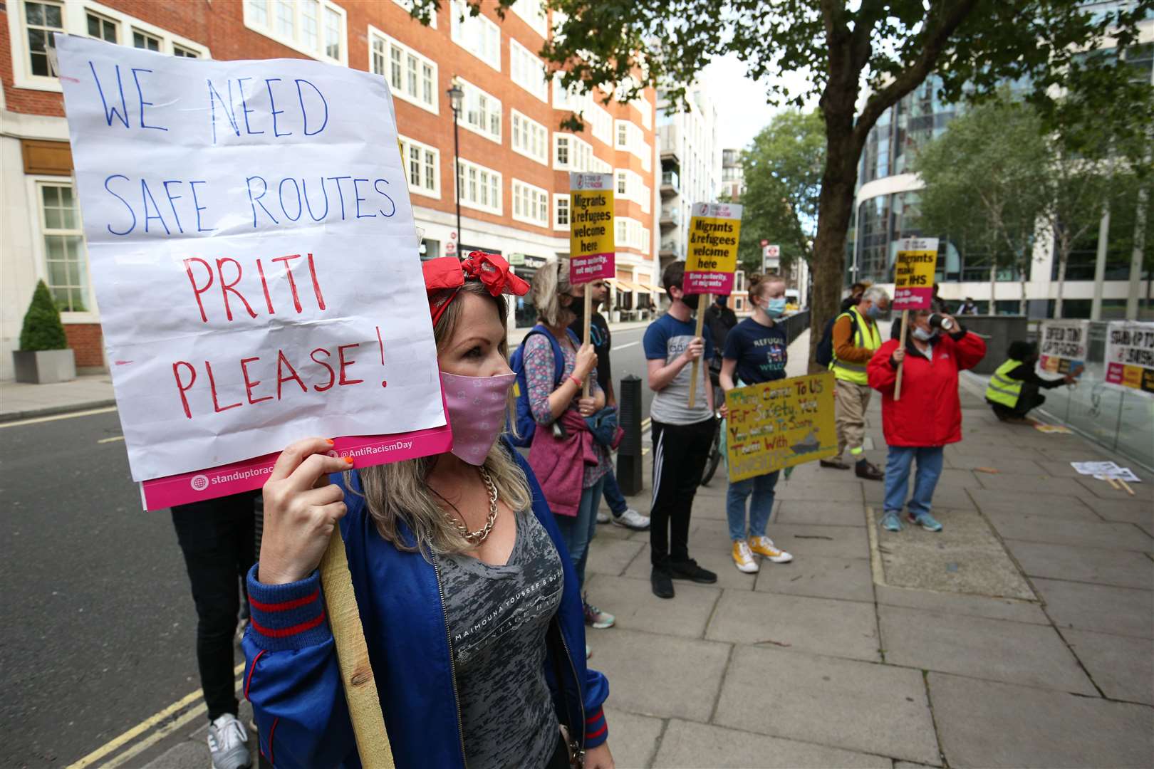 Pro-migrant protesters outside the Home Office in central London (Jonathan Brady/PA)