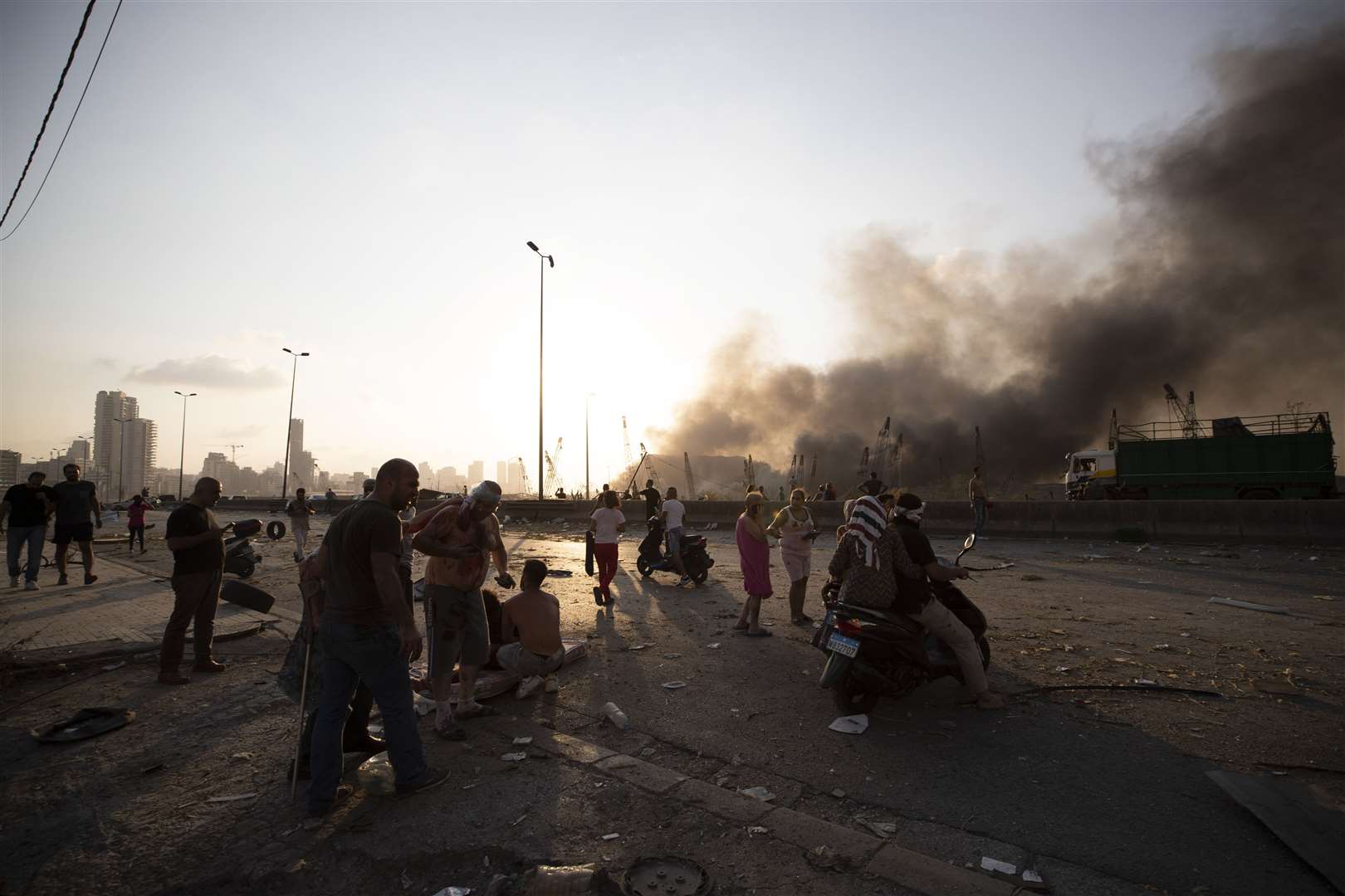 The blast destroyed buildings miles around it, injuring thousands (Hassan Ammar/AP)