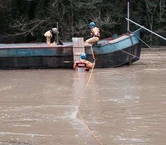 A woman is rescued off a house boat in Maidstone. Picture: Medway Coastgaurd