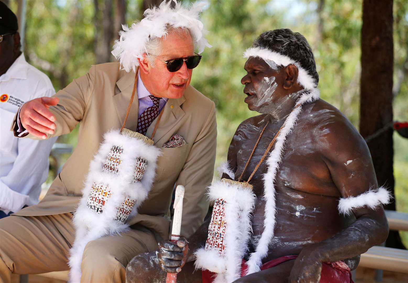 Charles wears a mulka string, a feather-stringed headband, during a visit to Mount Nhulun in 2018 (Phil Noble/PA)