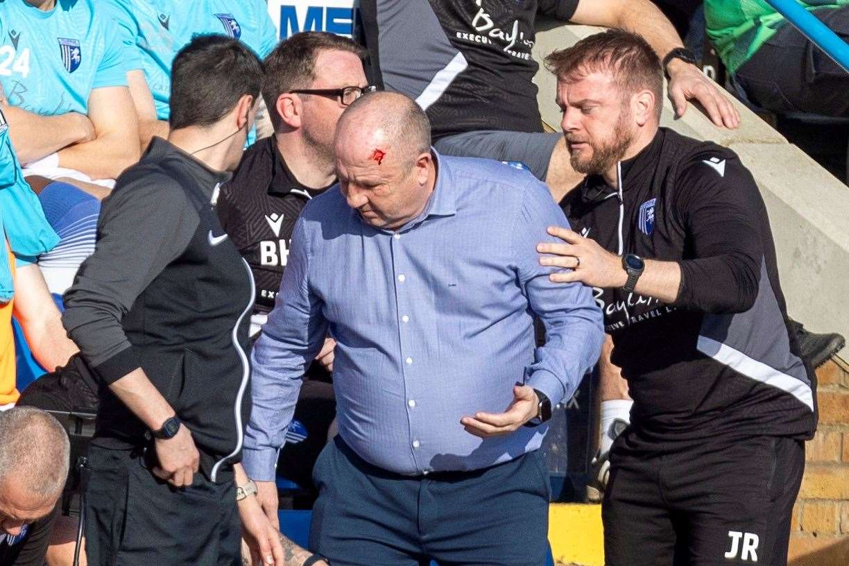 John Coleman needs treatment to a head injury during Gillingham’s game against Bradford City Picture: @Julian_KPI