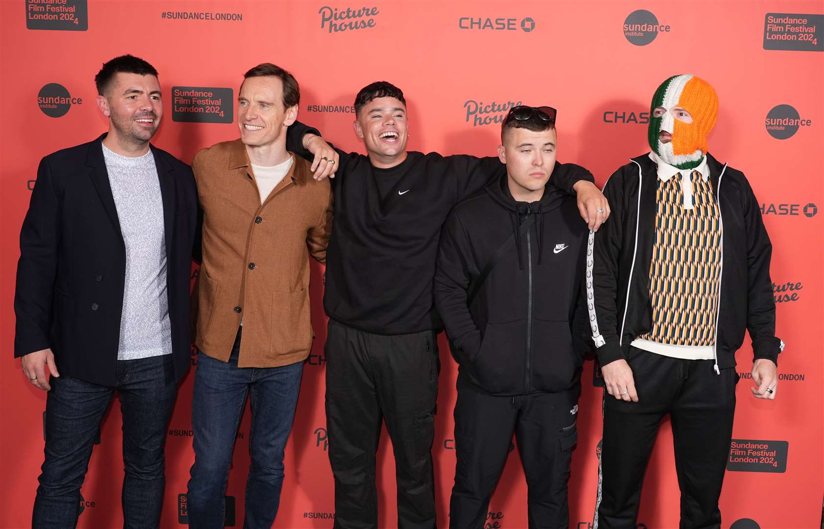 Rich Peppiatt, Michael Fassbender, and Kneecap attend the UK premiere of Kneecap, the opening film of the Sundance London Film Festival, at the Picturehouse Central Cinema, London in June 2024 (PA) 