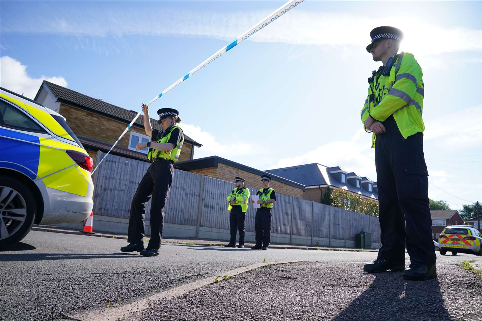 Police officers at the scene in Ashlyn Close, Bushey, Hertfordshire (Jonathan Brady/PA)