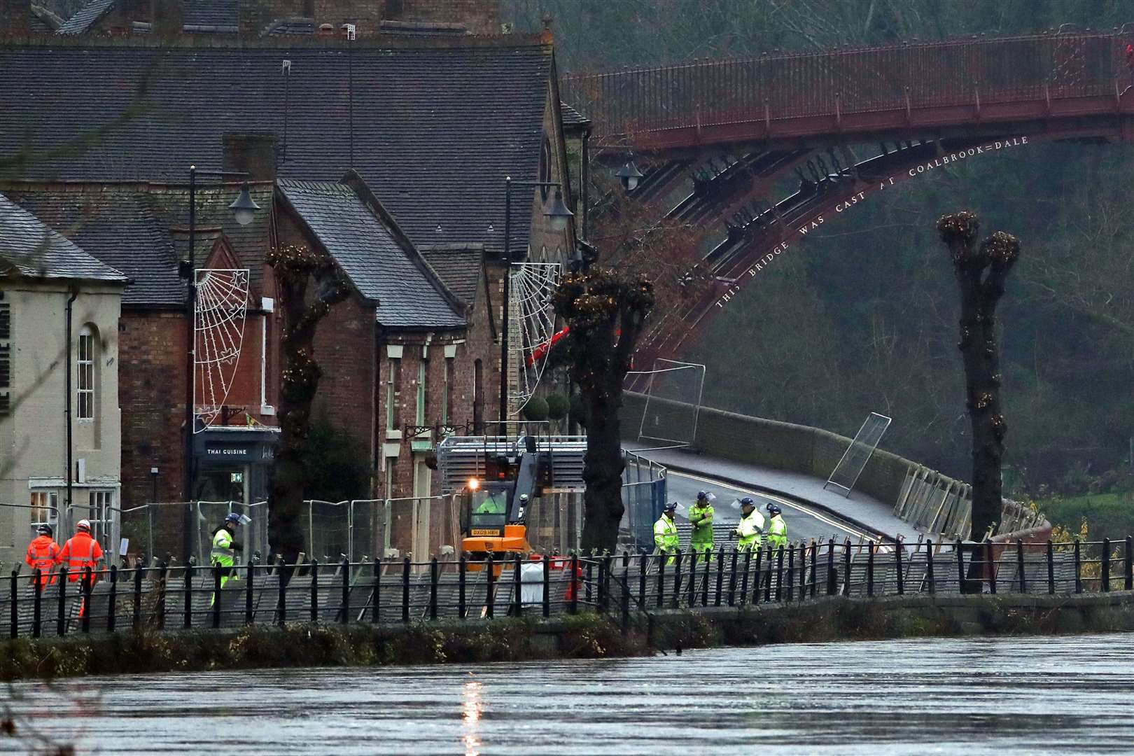 Flood barriers being erected on the River Severn, near Ironbridge, Shropshire (Nick Potts/PA)