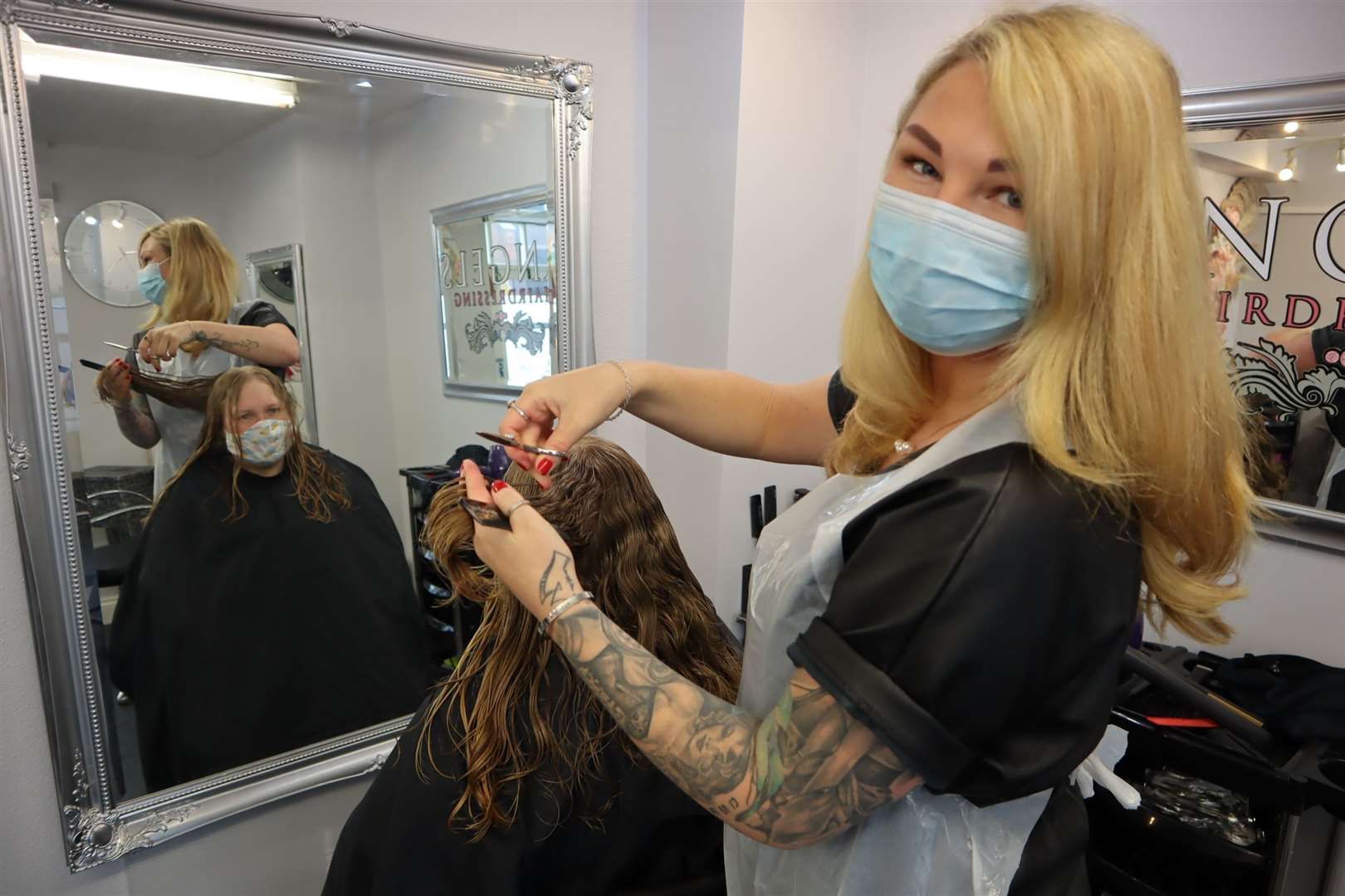 Hairdresser Sinitta Bradish at Angels in Sheerness High Street with her first customer Louisa Paolillo