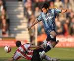 Zheng Zhi is tackled by Phil Ifil. Picture: BARRY GOODWIN