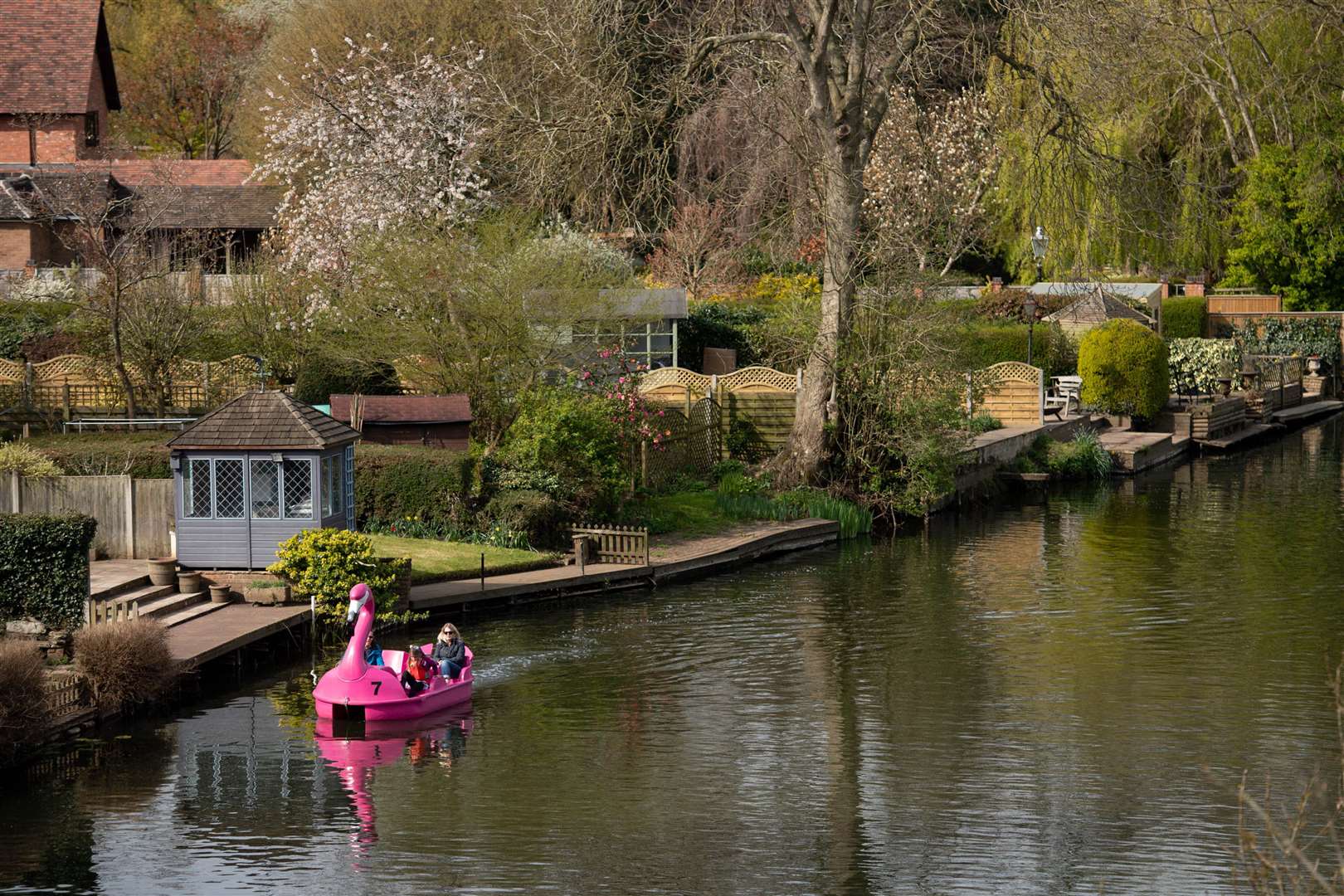 People use a pedalo on the Avon (Jacob King/PA)