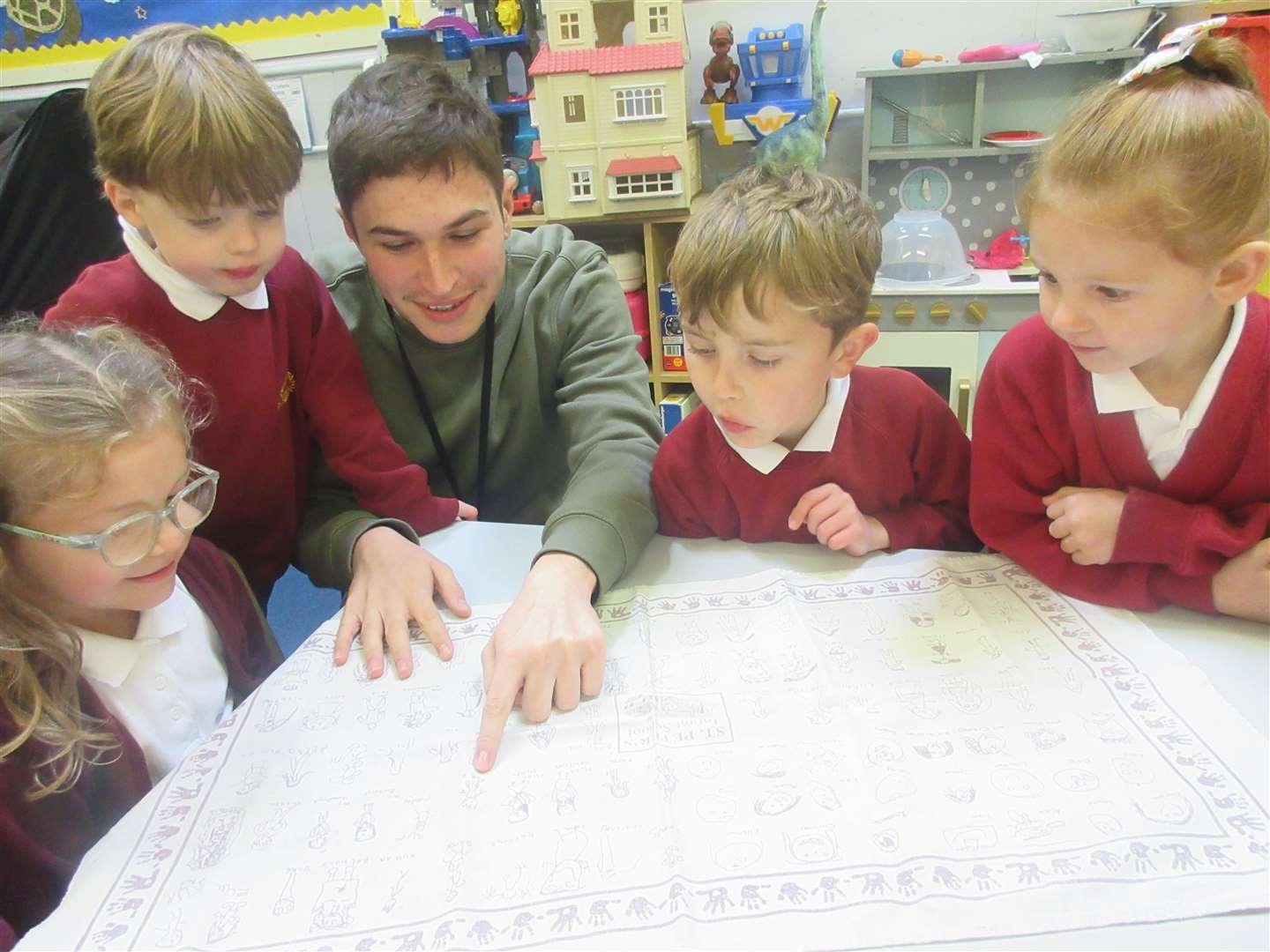 Teacher at St Peter's Infant School Reo Mardell with school children