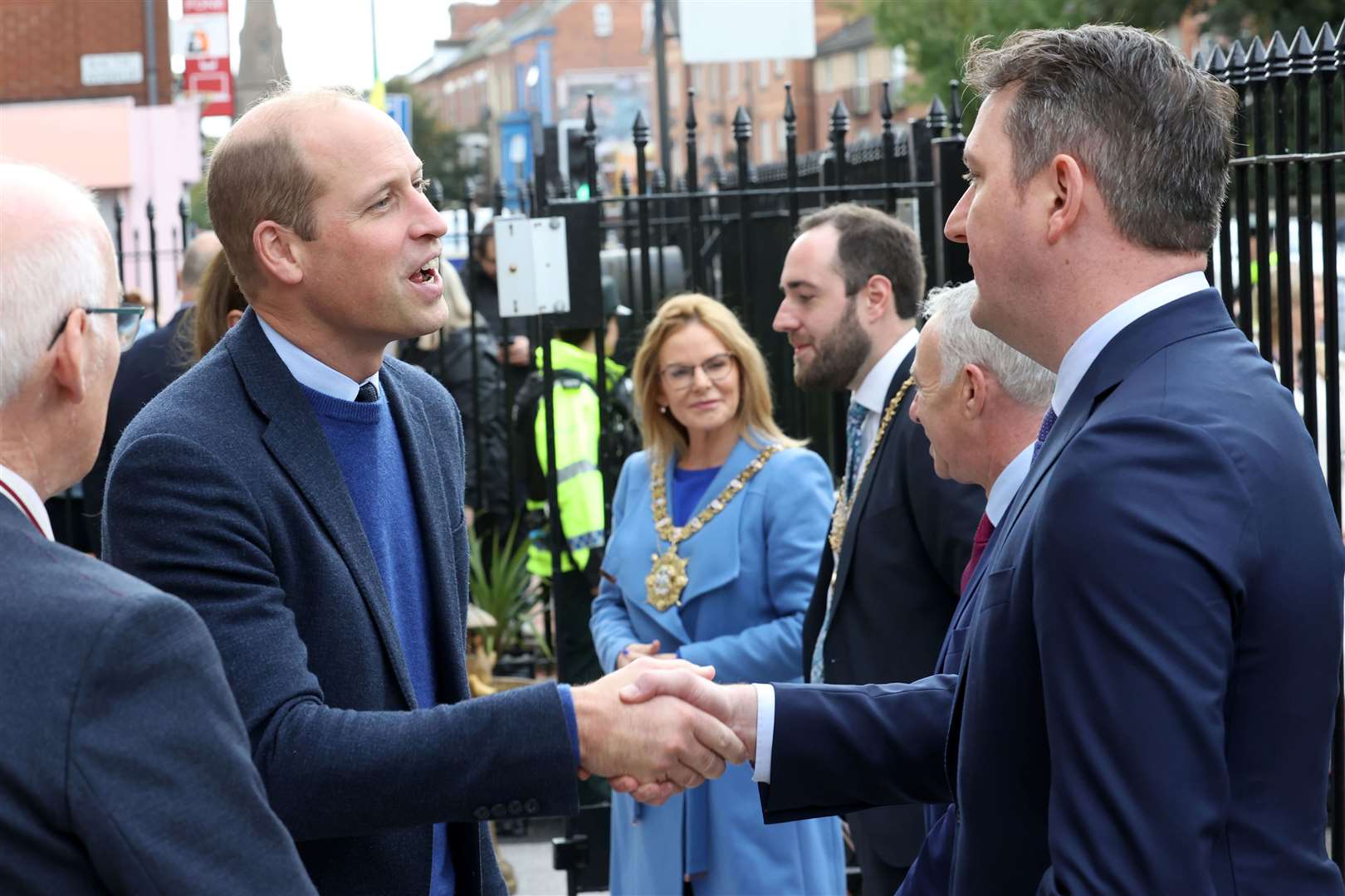 The Prince of Wales talking to North Belfast MP John Finucane during a visit to PIPS charity (Liam McBurney/PA)