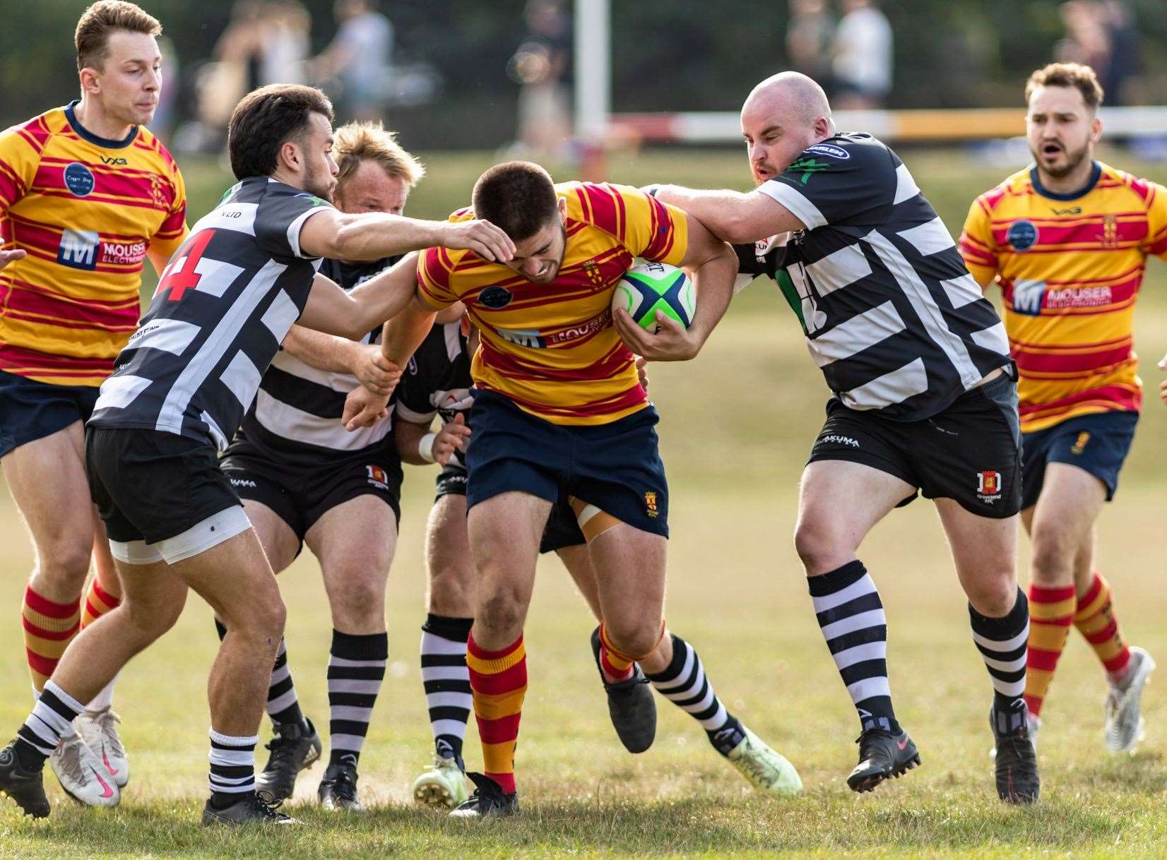 Medway's Max Bullock draws in four Gravesend players. Picture: Jake Miles Photography