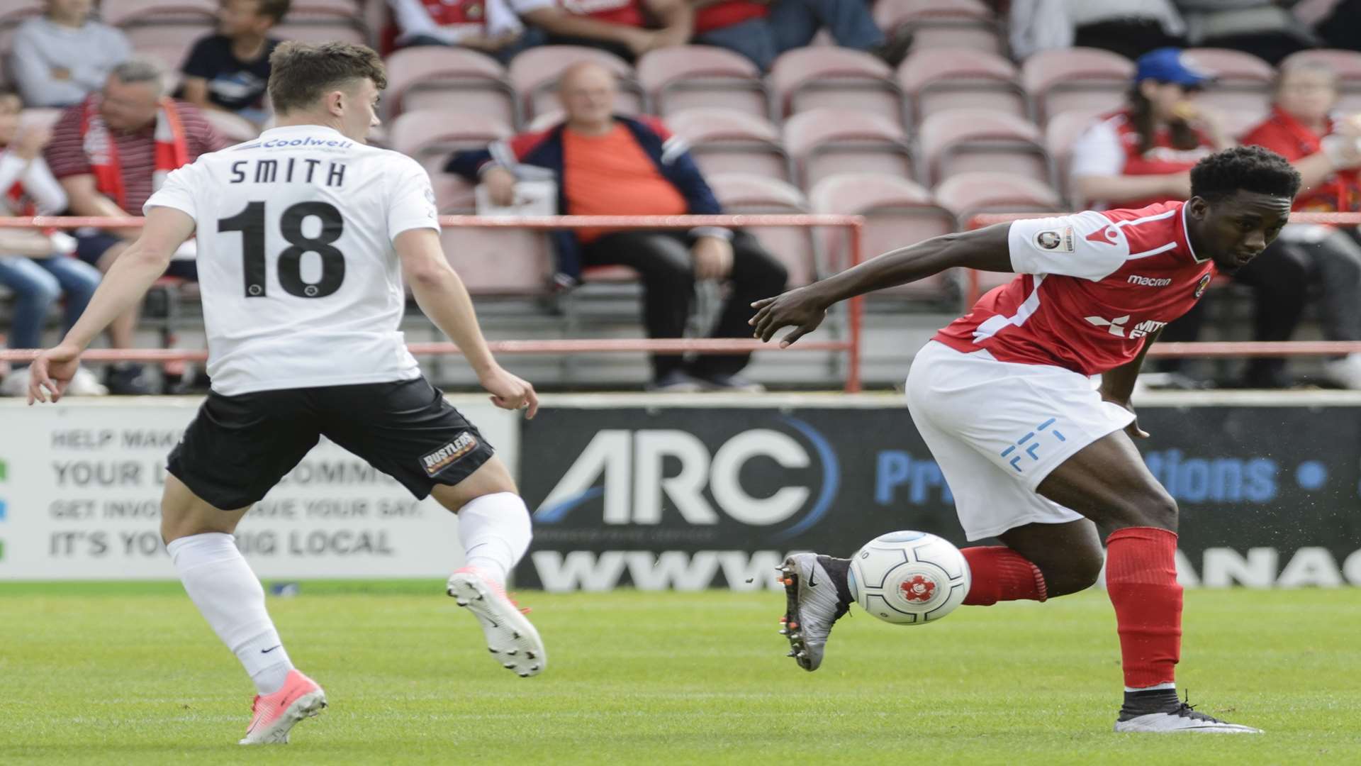 Fleet's Marvin McCoy comes up against Jonny Smith. Picture: Andy Payton