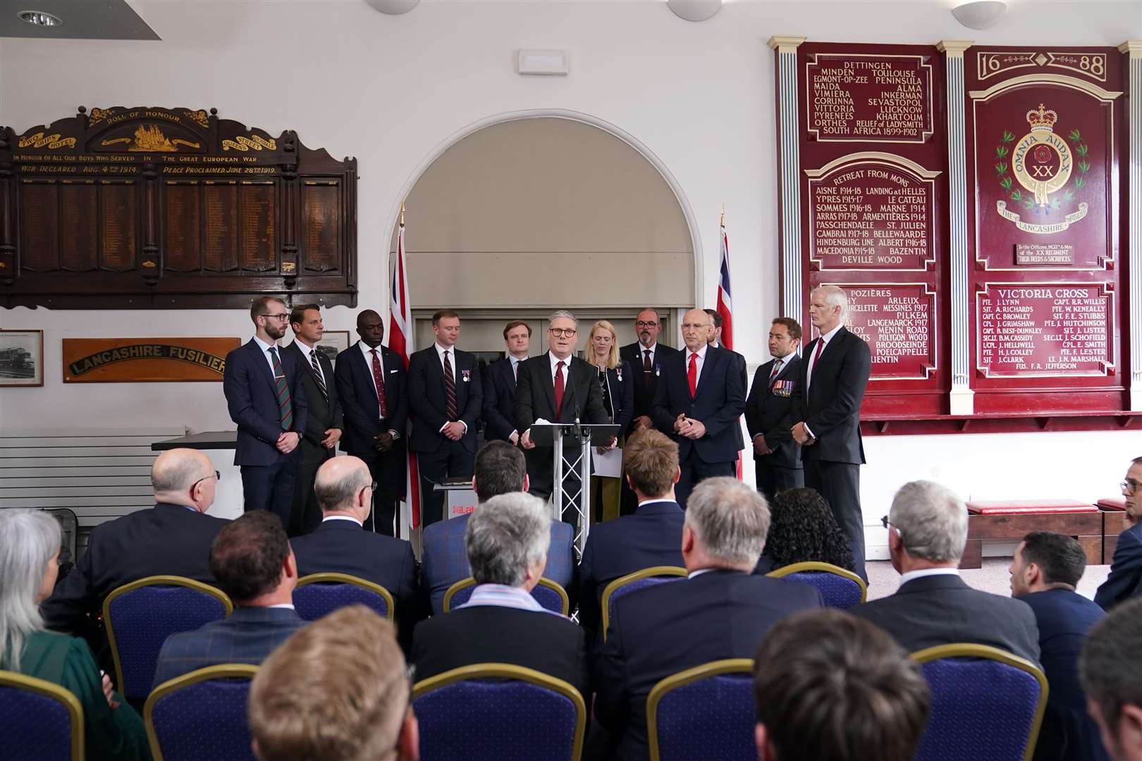 Sir Keir Starmer gave his speech to an audience of veterans flanked by 10 ex-military Labour candidates (Stefan Rousseau/PA)