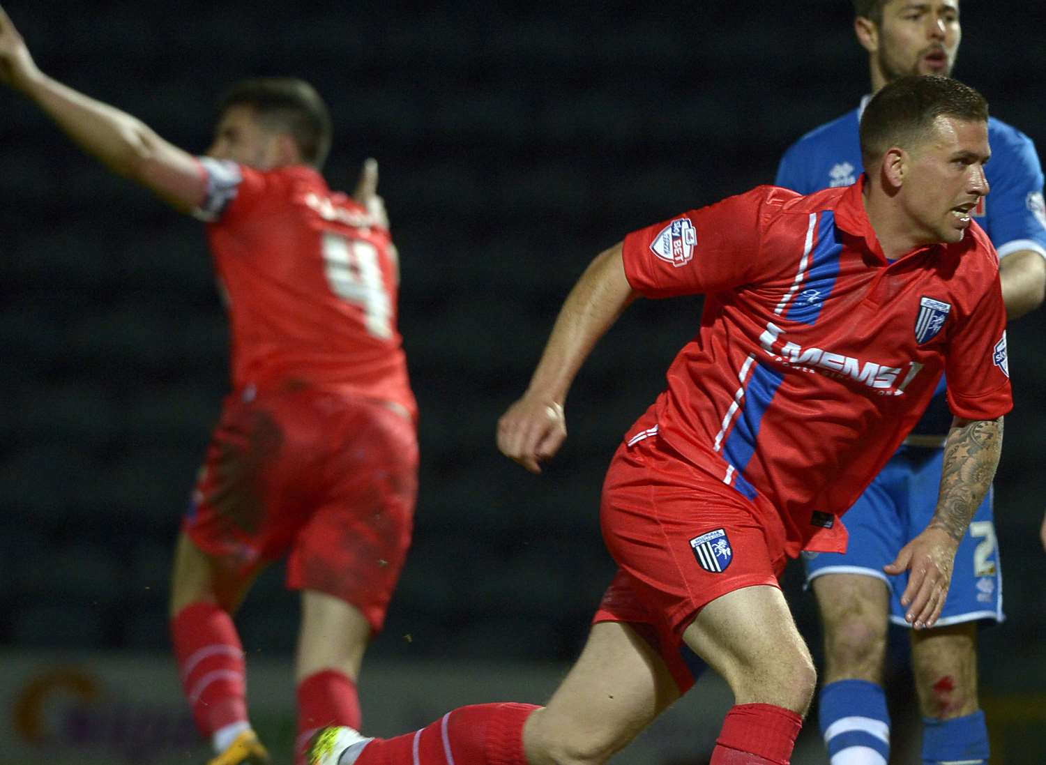 Cody McDonald is eager to get on with it while John Egan, background, celebrates his late leveller against Rochdale Picture: Barry Goodwin