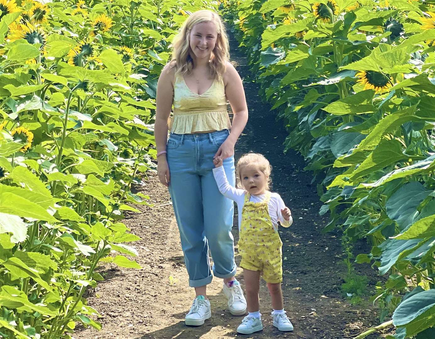 Toddler Hallie with mum Rachael before her condition started to deteriorate