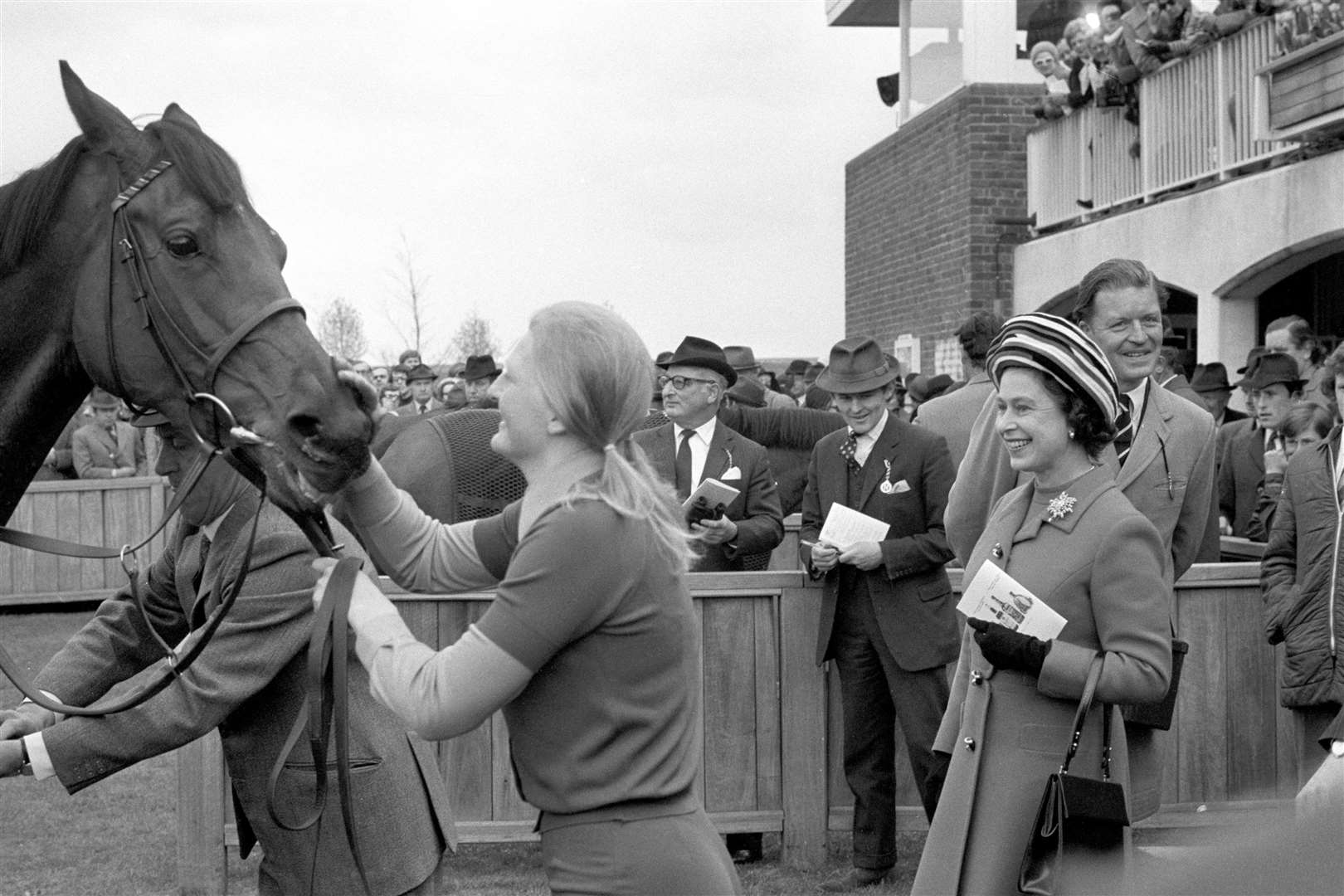 The Queen is all smiles after Highclere wins the 1000 Guineas at Newmarket in 1974 (PA)